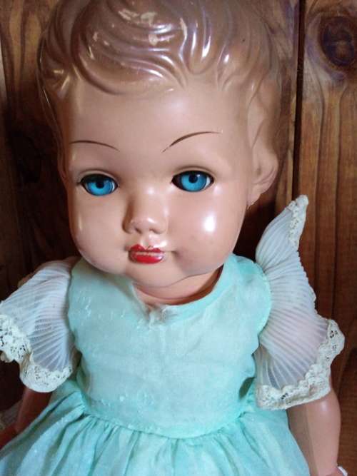 Old Vinyl Plastic Doll with Blue Eyes That Open and Close