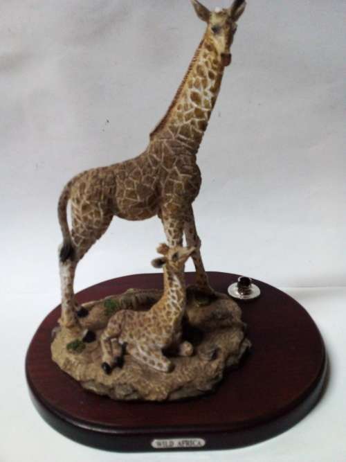 Resin giraffes on stand ornament