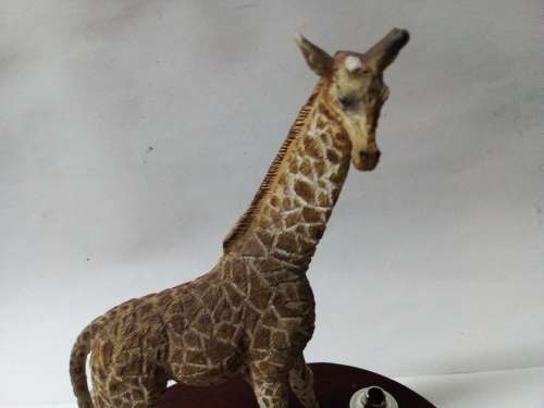 Resin giraffes on stand ornament