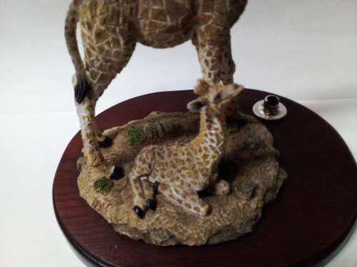 Resin giraffes on stand ornament