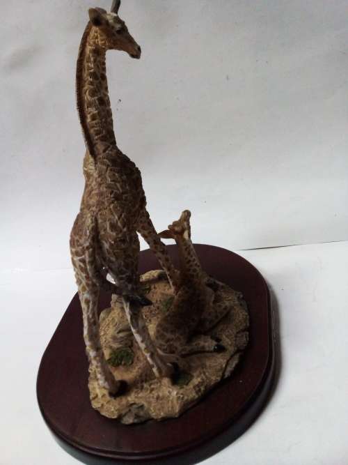 Resin giraffes on stand ornament