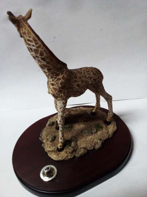 Resin giraffes on stand ornament