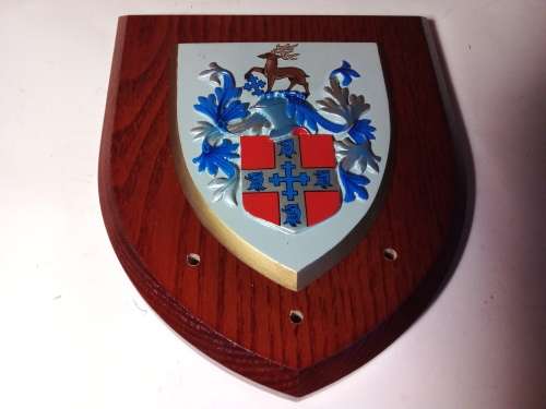 Plaque on wood.