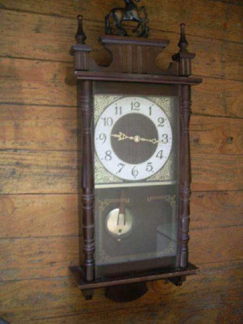 Clock in Attractive Pine Casing