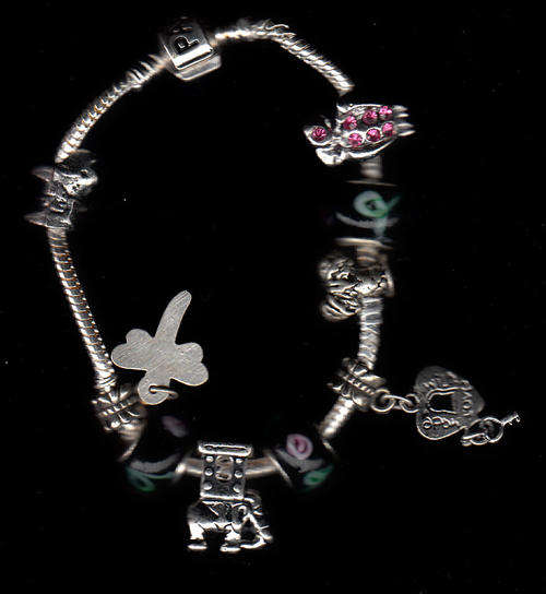 Lovely genuine sterling silver Pandora Braclet with 9 charms '