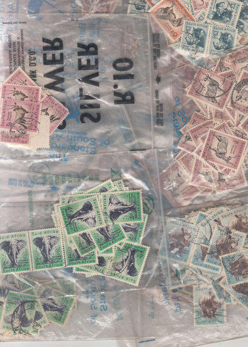 Mixed used South African many thousands in cardboard box sorted in plastic bags much duplication