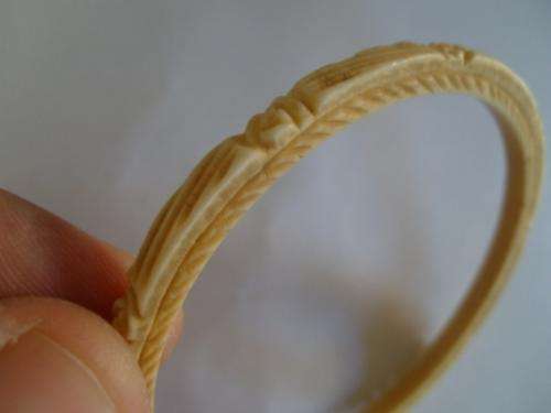 ANOTHER +- 100YEARS OLD CARVED IVORY BANGLE