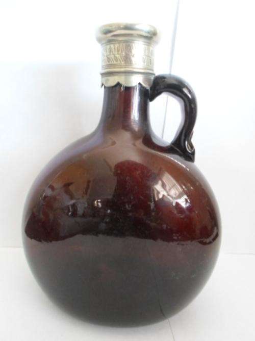 EARLY VICTORIAN BROWN GLASS DECANTER WITH SILVER PLATED TOP CIRCA 1840