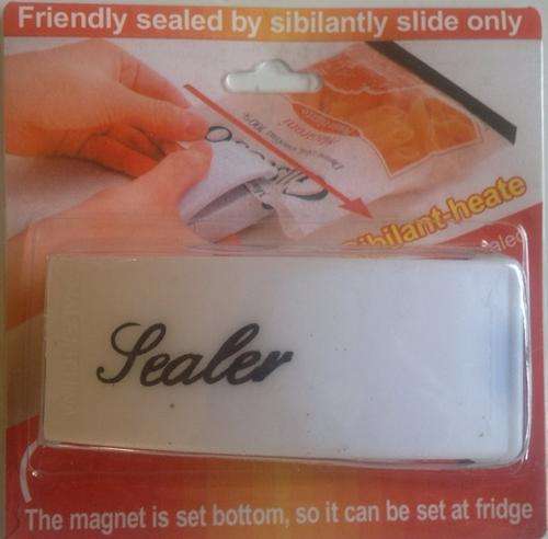 Small handy sealer with magnet attached to the bottom, so it can be set on your fridge.