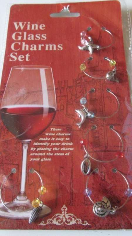 6 Stunning wine glass charms. (only one set available)