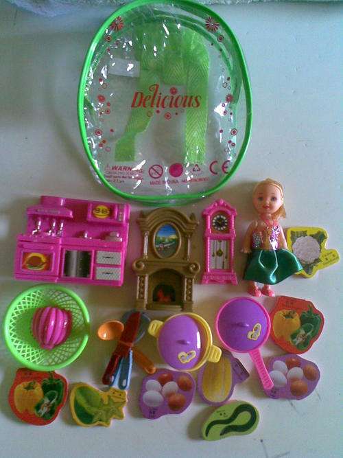 Doll in a bag with with furniture, pots, pans, ect...Postage only R30 and R10 per additional item!!!