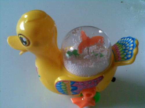 Walking duckie with pull back string Postage only R30 and R10 per additional item