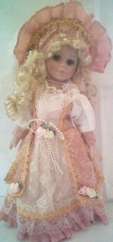 Little Pink lady. Very very pretty porcelain doll.