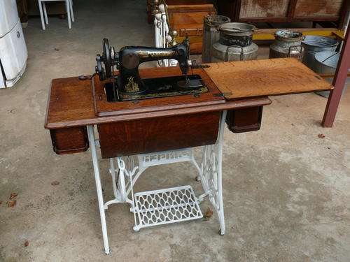 Singer sewing machine on stand.