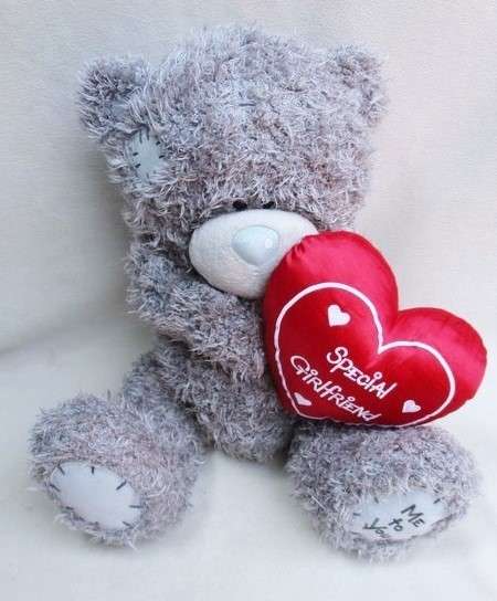A LARGE TATTY TEDDY  (ME TO YOU)  HOLDING A 'SPECIAL GIRLFRIEND' HEART!!