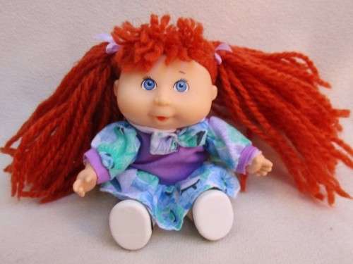 A TINY VINTAGE 1995 ORIGINAL CABBAGE PATCH DOLLY  WITH SIGNATURE ON BOTTOM!!
