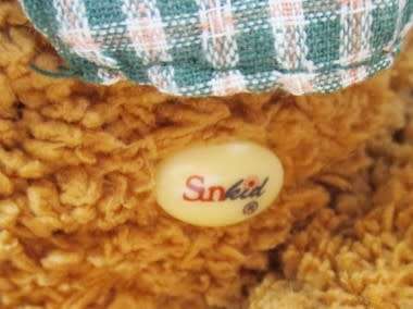 A VERY COLLECTABLE SUNKID, GERMANY WITH ORIGINAL BUTTON AND DROP STITCH NOSE!!