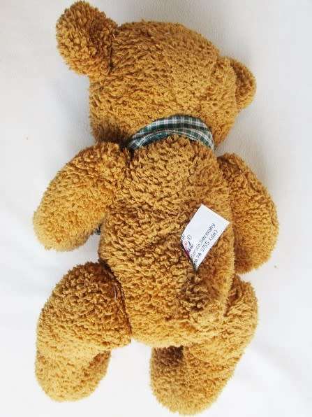 A VERY COLLECTABLE SUNKID, GERMANY WITH ORIGINAL BUTTON AND DROP STITCH NOSE!!
