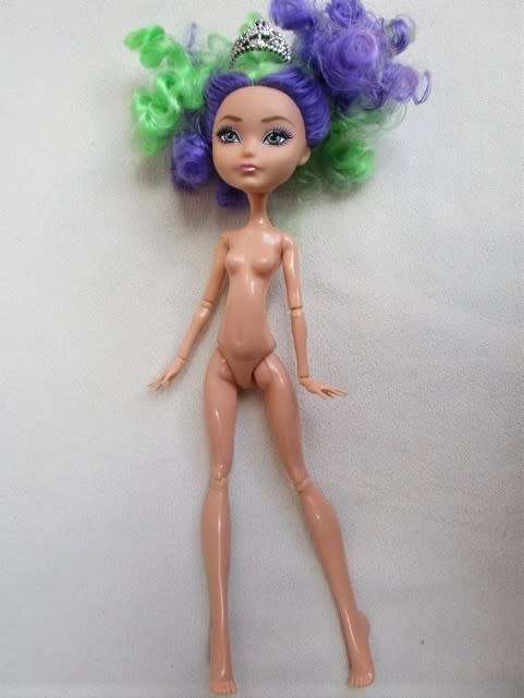 A PRETTY  CURLY HEADED FASHION DOLL IN MERMAID'S COSTUME