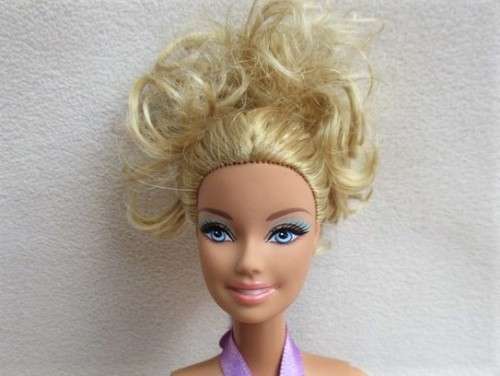 PRETTY CURLY-TOPPED MATTEL BARBIE DOLL