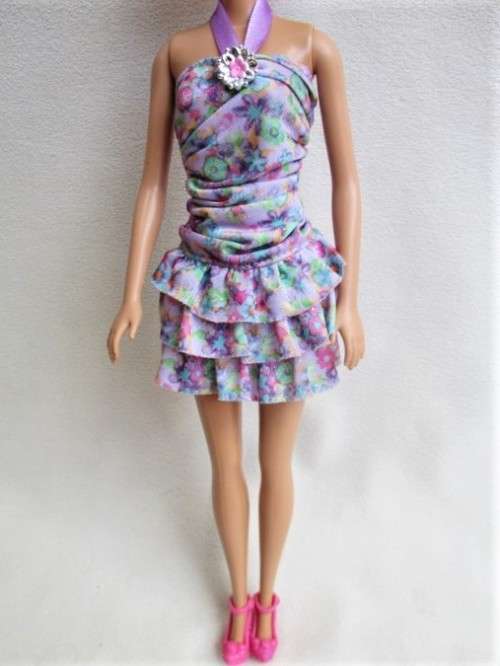 PRETTY CURLY-TOPPED MATTEL BARBIE DOLL