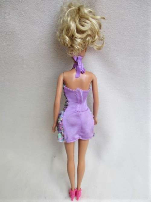 PRETTY CURLY-TOPPED MATTEL BARBIE DOLL
