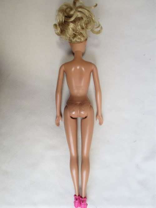 PRETTY CURLY-TOPPED MATTEL BARBIE DOLL