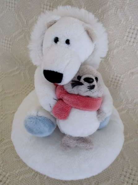 A NICI POLAR BEAR HOLDING A BABY SEAL AND HIS WIMPY POLAR BEAR FRIEND