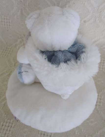 A NICI POLAR BEAR HOLDING A BABY SEAL AND HIS WIMPY POLAR BEAR FRIEND