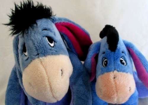 TWO CUTE EEYORES FROM WINNIE THE POOH - ONE SAD AND ONE CONTENTED