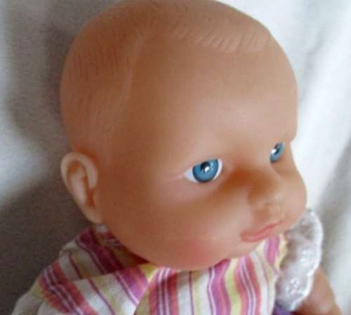 A VERY COLLECTABLE SMALL SUM SUM ANATOMICALLY CORRECT BABY DOLL WITH TWO CUTE FRONT TEETH!
