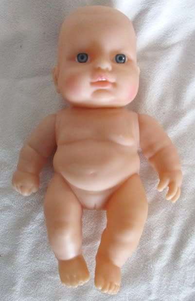 A VERY COLLECTABLE SMALL SUM SUM ANATOMICALLY CORRECT BABY DOLL WITH TWO CUTE FRONT TEETH!