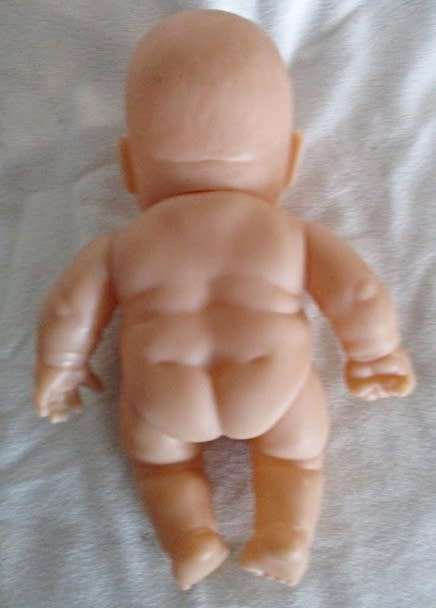 A VERY COLLECTABLE SMALL SUM SUM ANATOMICALLY CORRECT BABY DOLL WITH TWO CUTE FRONT TEETH!