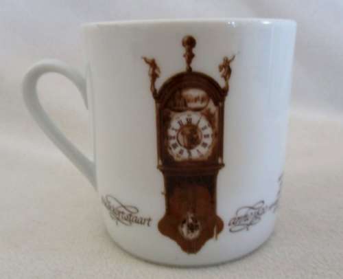 FOUR MITTERTEICH COFFEE CUPS AND SAUCERS - HOLLAND CLOCK DESIGN NO'S 1 TO 4