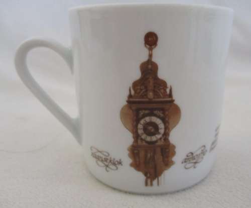 FOUR MITTERTEICH COFFEE CUPS AND SAUCERS - HOLLAND CLOCK DESIGN NO'S 1 TO 4
