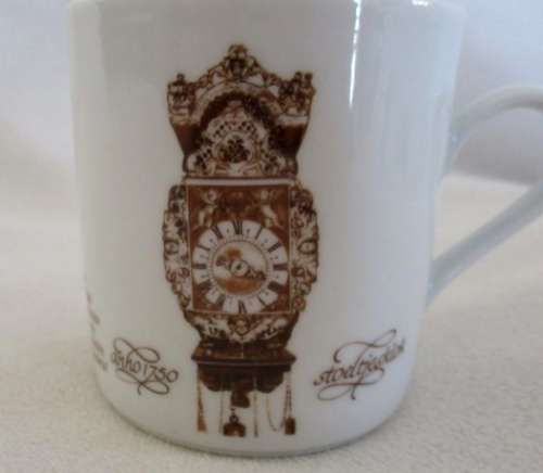 FOUR MITTERTEICH COFFEE CUPS AND SAUCERS - HOLLAND CLOCK DESIGN NO'S 1 TO 4