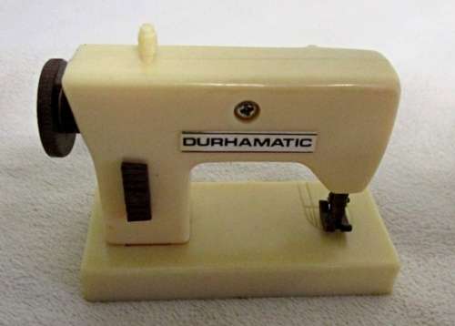 A SET OF VINTAGE 1970's/80s DURHAMTIC WIND-UP DOLL'S HOUSE APPLIANCES MADE IN HONG KONG