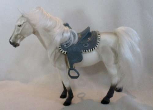 A GORGEOUS HARD PLASTIC HORSE WITH SADDLE