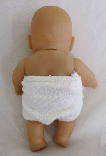 A VERY COLLECTABLE SMALL SUM SUM ANATOMICALLY CORRECT BABY DOLL WITH TWO CUTE FRONT TEETH!