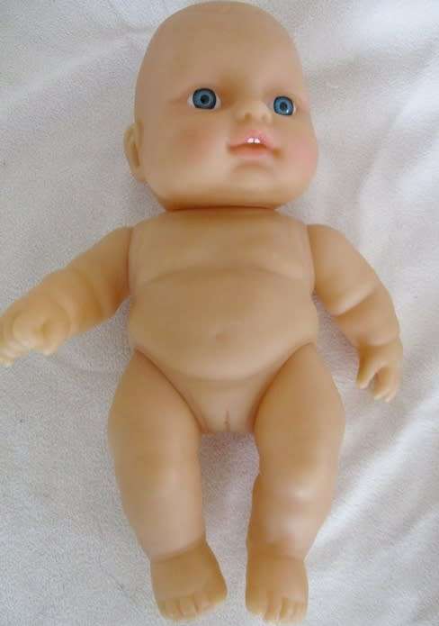 A VERY COLLECTABLE SMALL SUM SUM ANATOMICALLY CORRECT BABY DOLL WITH TWO CUTE FRONT TEETH!