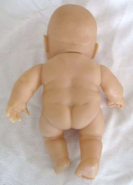 A VERY COLLECTABLE SMALL SUM SUM ANATOMICALLY CORRECT BABY DOLL WITH TWO CUTE FRONT TEETH!