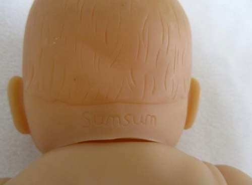 A VERY COLLECTABLE SMALL SUM SUM ANATOMICALLY CORRECT BABY DOLL WITH TWO CUTE FRONT TEETH!