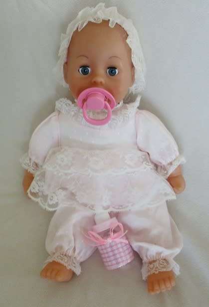 A VERY COLLECTABLE CRYING, GURGLING, COOING BATTAT BABY DOLL WITH OPEN/CLOSE EYES