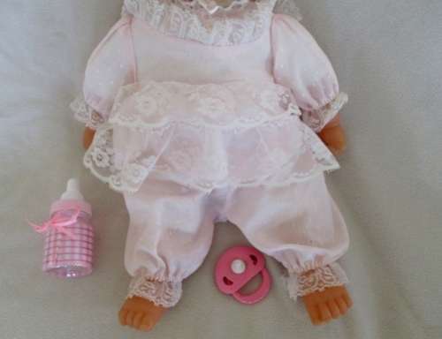 A VERY COLLECTABLE CRYING, GURGLING, COOING BATTAT BABY DOLL WITH OPEN/CLOSE EYES