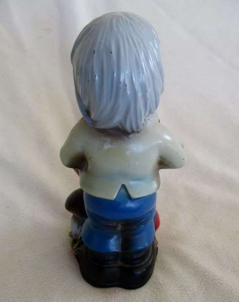 A VERY OLD 19CM TALL VINTAGE HARD RUBBER GNOME CARRYING A CORNUCOPIA OF MUSHROOMS!!
