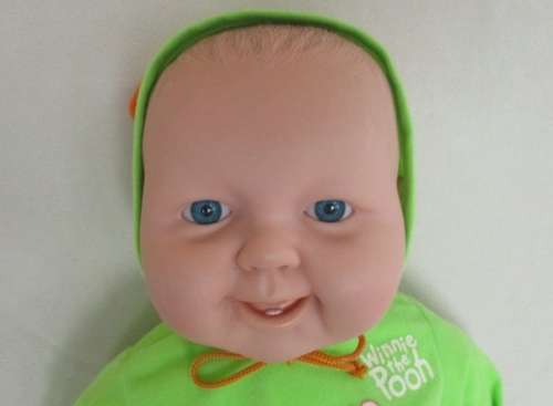A LARGE, HAPPY 54CM TALL BABY DOLL WITH TWO CUTE FRONT TEETH