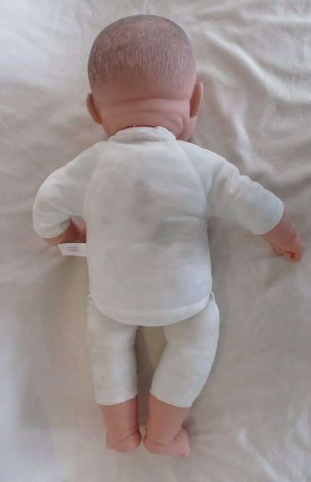 A LARGE, HAPPY 54CM TALL BABY DOLL WITH TWO CUTE FRONT TEETH