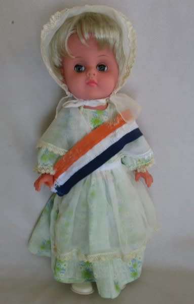 VINTAGE VOORTREKKER COMMEMORATION DOLL WITH HER VOORTREKKER 'KAPPIE' AND 'ORANJE, BLANJE,BLOU' SASH