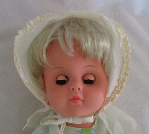 VINTAGE VOORTREKKER COMMEMORATION DOLL WITH HER VOORTREKKER 'KAPPIE' AND 'ORANJE, BLANJE,BLOU' SASH