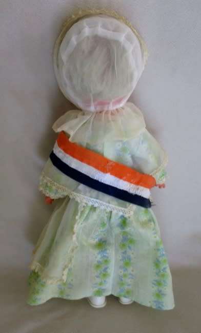 VINTAGE VOORTREKKER COMMEMORATION DOLL WITH HER VOORTREKKER 'KAPPIE' AND 'ORANJE, BLANJE,BLOU' SASH